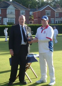 Mike Leyman of Le Roy Funerals presenting bowls trophy to bowls player