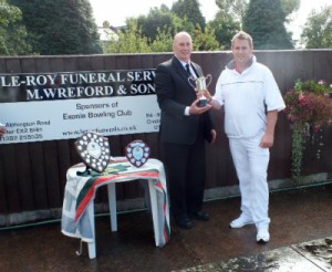 Mike Leyman of Le Roy Funerals presents bowls trophy to Rob Praxton