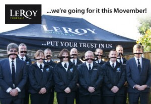 Le Roy Funerals staff with false moustaches